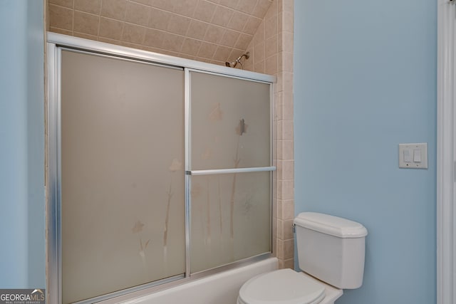 full bathroom with toilet and enclosed tub / shower combo