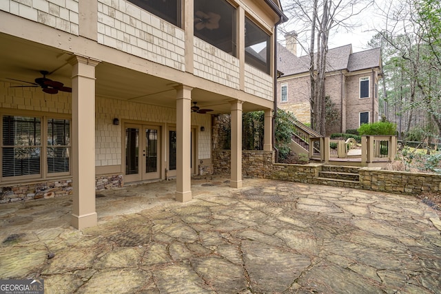 view of patio / terrace with stairway, french doors, and a ceiling fan