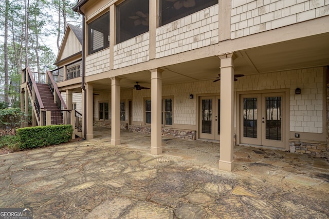 rear view of property featuring stairway, ceiling fan, a patio, and french doors