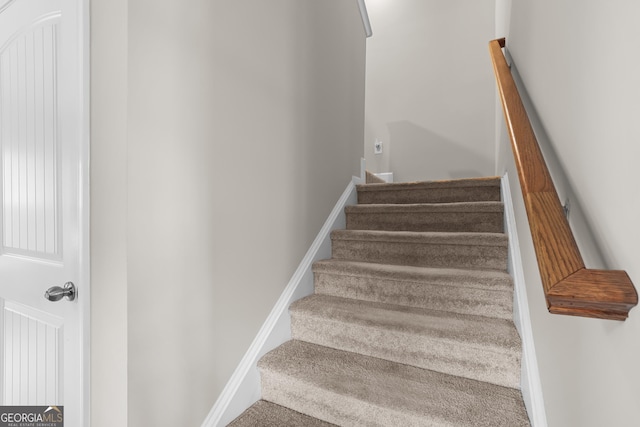 stairs featuring baseboards