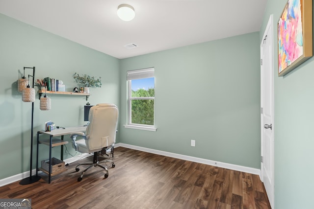 office area featuring baseboards, wood finished floors, and visible vents