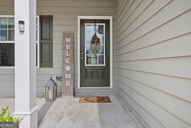 doorway to property featuring covered porch