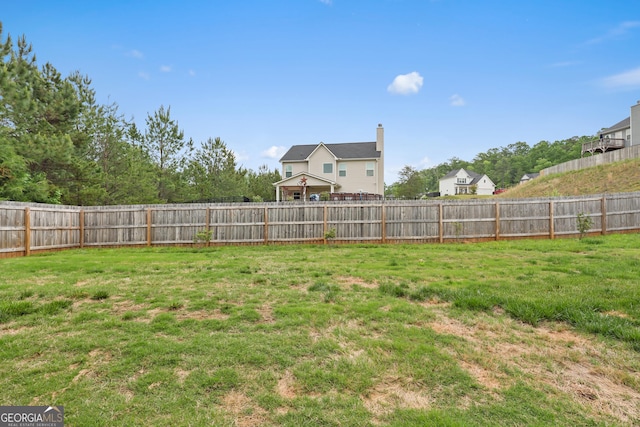 view of yard featuring a fenced backyard
