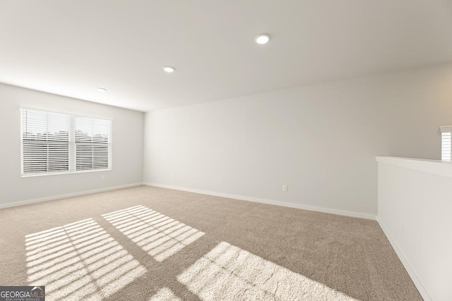 spare room with baseboards, carpet flooring, and recessed lighting