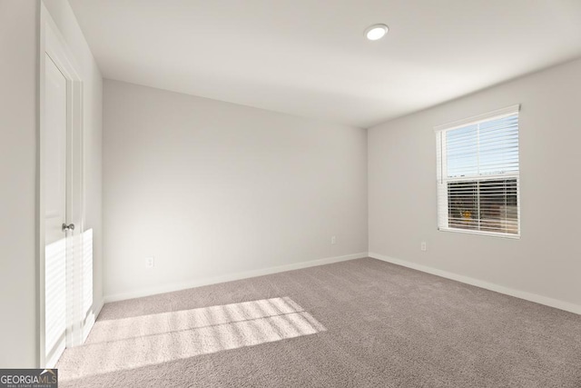interior space with carpet floors and baseboards