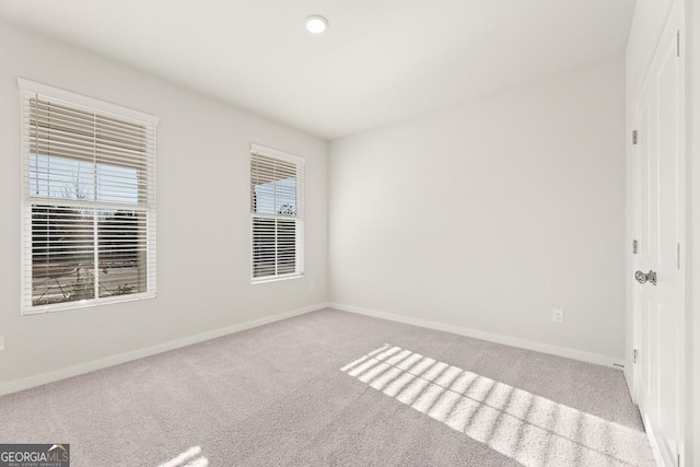 unfurnished bedroom featuring baseboards, recessed lighting, and carpet
