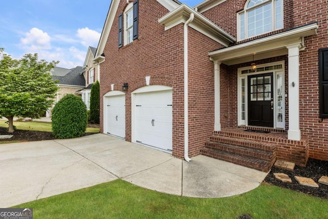 12892 Waterside Dr, Milton, GA 30004 - view of property exterior with an attached garage, brick siding, and concrete driveway