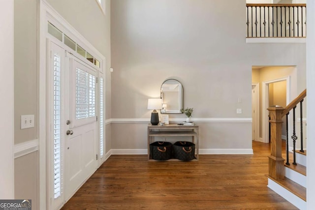 12892 Waterside Dr, Milton, GA 30004 - foyer with a high ceiling, baseboards, wood finished floors, and stairway