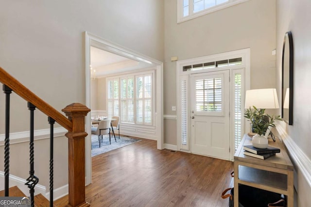 12892 Waterside Dr, Milton, GA 30004 - entryway with a towering ceiling, wood finished floors, and stairway