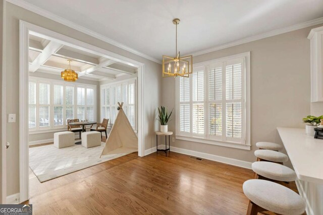 12892 Waterside Dr, Milton, GA 30004 - interior space featuring a healthy amount of sunlight, baseboards, and a notable chandelier