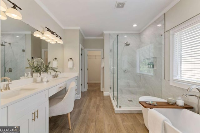 12892 Waterside Dr, Milton, GA 30004 - full bathroom with visible vents, a sink, wood finished floors, and a shower stall
