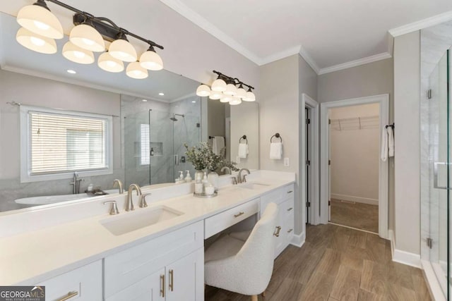 12892 Waterside Dr, Milton, GA 30004 - full bath featuring a shower stall, double vanity, a walk in closet, wood finished floors, and crown molding