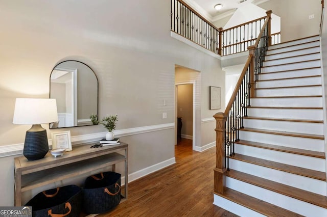 12892 Waterside Dr, Milton, GA 30004 - stairs featuring wood finished floors and a high ceiling