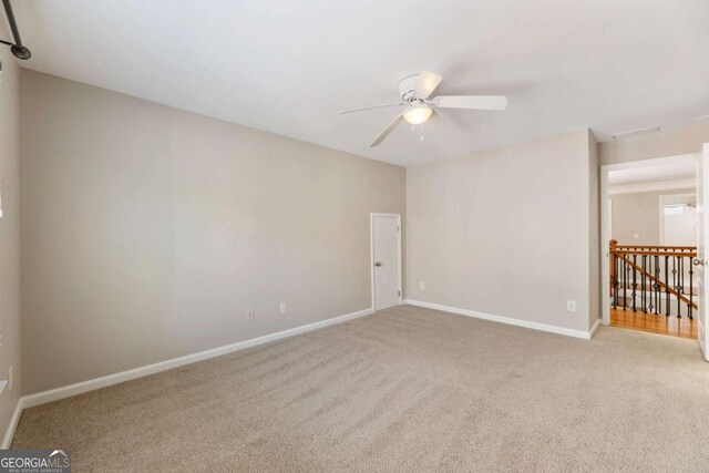 12892 Waterside Dr, Milton, GA 30004 - carpeted empty room with baseboards and ceiling fan