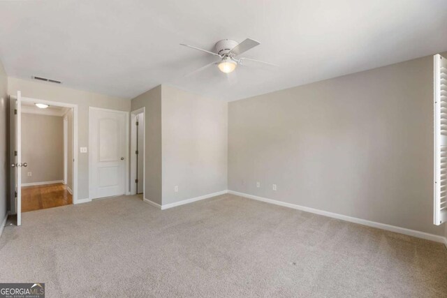 12892 Waterside Dr, Milton, GA 30004 - interior space with light colored carpet, baseboards, ceiling fan, and visible vents