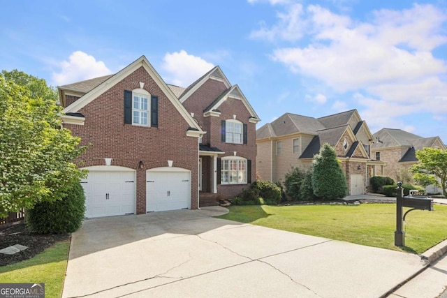 12892 Waterside Dr, Milton, GA 30004 - traditional-style house with an attached garage, concrete driveway, a front lawn, and brick siding