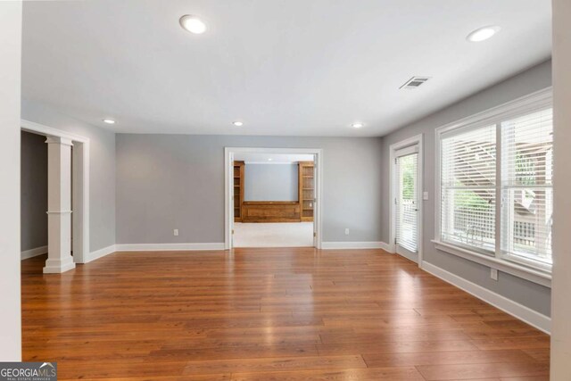 12892 Waterside Dr, Milton, GA 30004 - unfurnished living room with visible vents, recessed lighting, baseboards, and wood finished floors