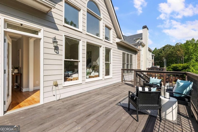 12892 Waterside Dr, Milton, GA 30004 - wooden deck with an outdoor living space