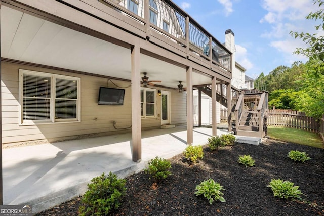 12892 Waterside Dr, Milton, GA 30004 - exterior space with fence, a deck, ceiling fan, and stairway