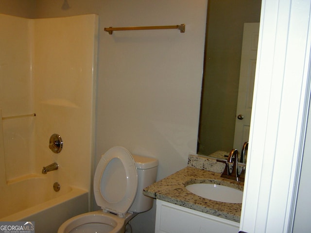 214 Oak Cir, Stockbridge, GA 30281 - bathroom with vanity, washtub / shower combination, and toilet