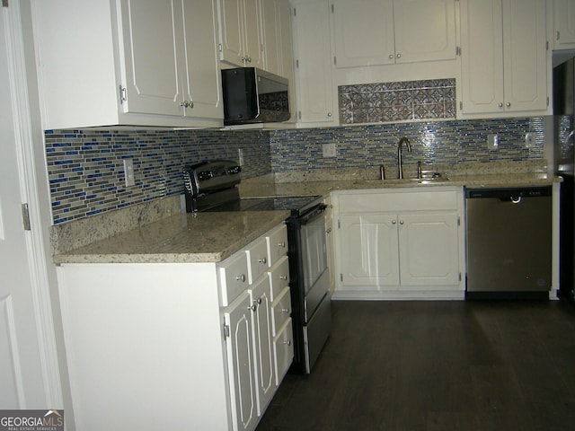 214 Oak Cir, Stockbridge, GA 30281 - kitchen with backsplash, white cabinetry, a sink, and black appliances