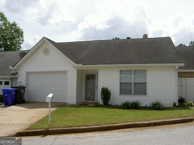 214 Oak Cir, Stockbridge, GA 30281 - view of front of property with a garage, driveway, and a front yard