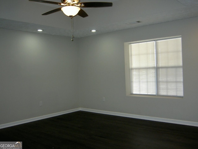 214 Oak Cir, Stockbridge, GA 30281 - spare room featuring recessed lighting, baseboards, a ceiling fan, and dark wood-type flooring