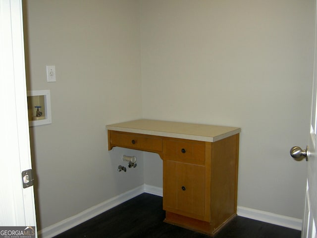 214 Oak Cir, Stockbridge, GA 30281 - laundry area featuring washer hookup, baseboards, laundry area, and dark wood-style floors