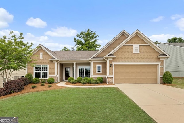 craftsman-style house featuring concrete driveway and a front lawn