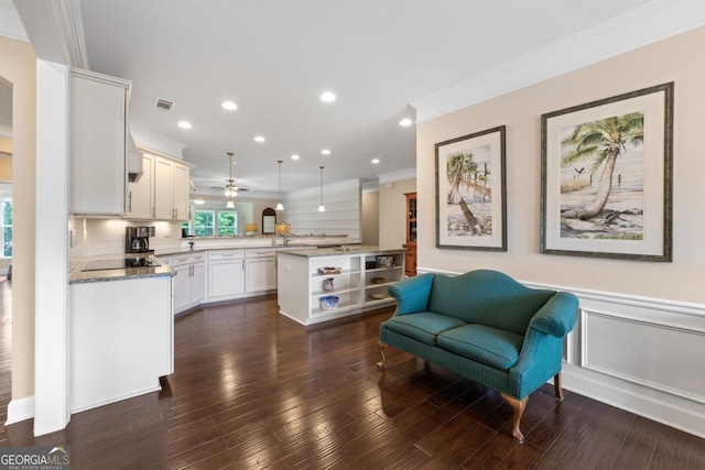 kitchen with open shelves, ceiling fan, a peninsula, visible vents, and ornamental molding
