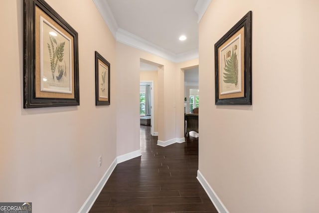 hall featuring baseboards, ornamental molding, dark wood-style floors, and recessed lighting