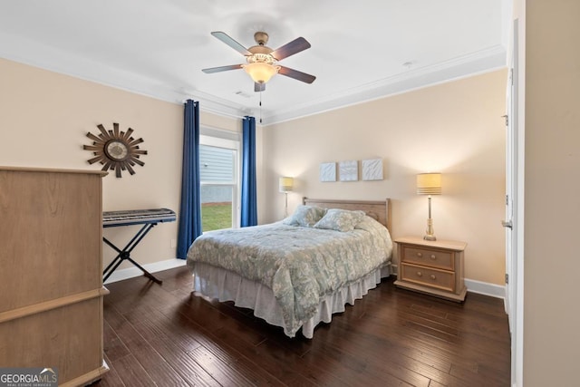 bedroom with dark wood-style flooring, baseboards, ornamental molding, and ceiling fan