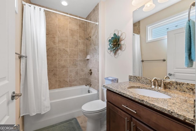 full bathroom featuring vanity, shower / bath combo, and toilet