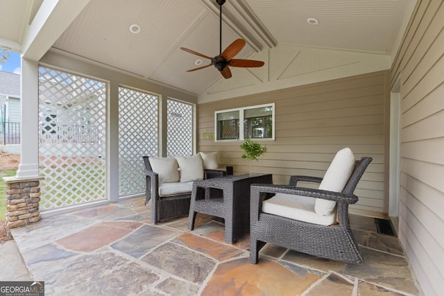 sunroom / solarium featuring an outdoor hangout area, ceiling fan, and beam ceiling