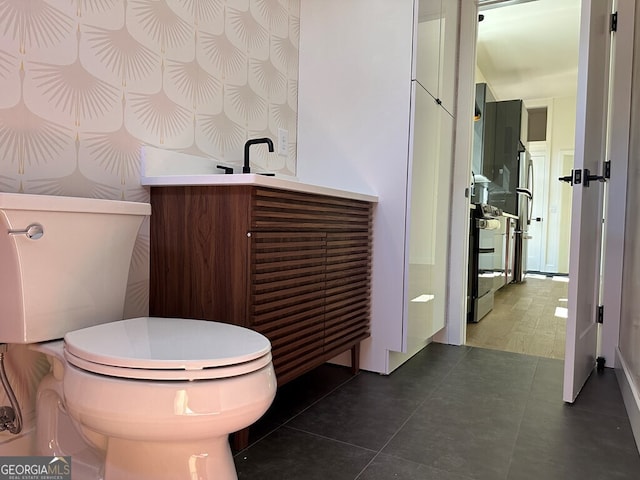 bathroom with tile patterned flooring and toilet