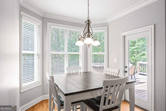 68 Timber Creek Estates Dr, Sharpsburg, GA 30277 - dining area featuring baseboards, a chandelier, ornamental molding, and light wood finished floors