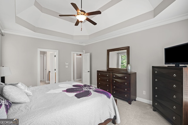 68 Timber Creek Estates Dr, Sharpsburg, GA 30277 - bedroom with a ceiling fan, light colored carpet, crown molding, baseboards, and a tray ceiling