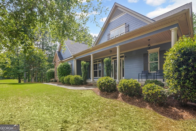 68 Timber Creek Estates Dr, Sharpsburg, GA 30277 - exterior space featuring a lawn, covered porch, and a shingled roof