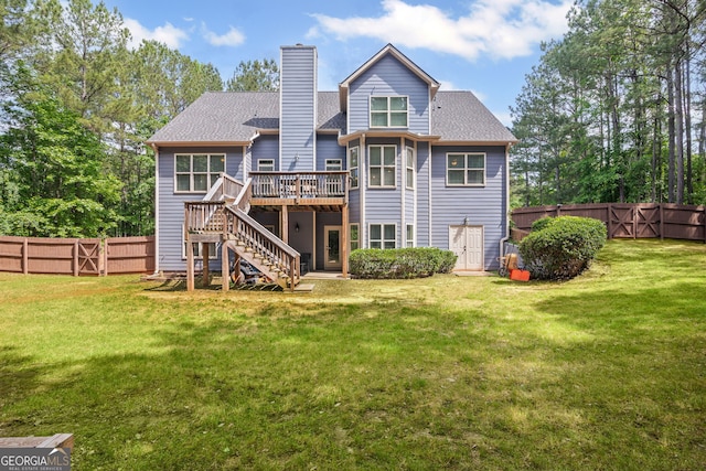 68 Timber Creek Estates Dr, Sharpsburg, GA 30277 - rear view of property with a fenced backyard, stairs, a chimney, and a deck