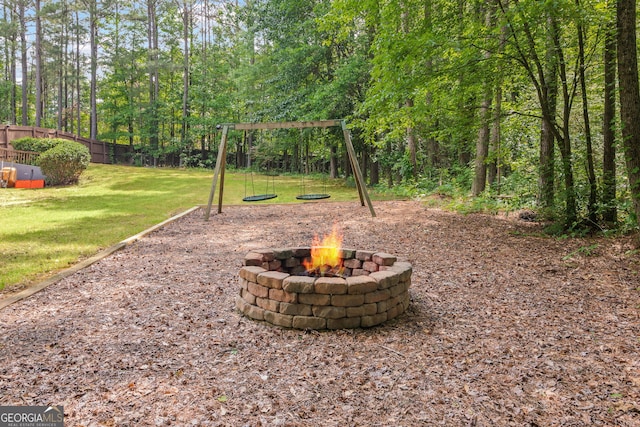 68 Timber Creek Estates Dr, Sharpsburg, GA 30277 - view of yard with fence, a fire pit, and a playground