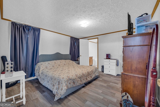 187 New Hope Rd, Canon, GA 30520 - bedroom with a textured ceiling, ornamental molding, and wood finished floors