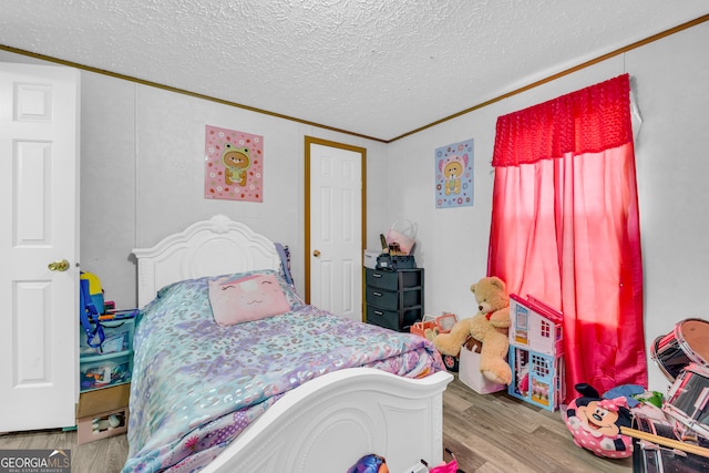 187 New Hope Rd, Canon, GA 30520 - bedroom featuring crown molding, a textured ceiling, and wood finished floors
