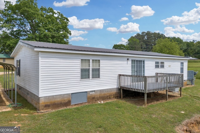 187 New Hope Rd, Canon, GA 30520 - rear view of property featuring metal roof, a yard, crawl space, and a deck