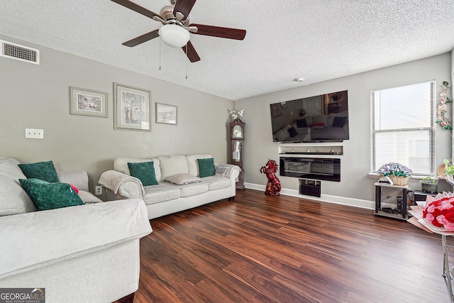 5022 Audubon Pl, Norcross, GA 30093 - living area featuring visible vents, a textured ceiling, ceiling fan, and wood finished floors