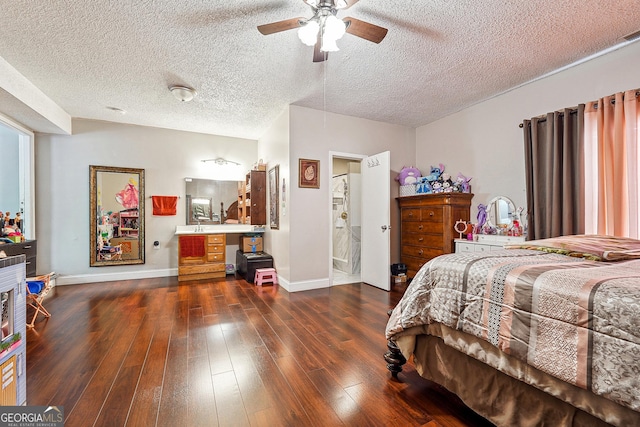 5022 Audubon Pl, Norcross, GA 30093 - bedroom featuring dark wood-style flooring, baseboards, ensuite bathroom, ceiling fan, and a textured ceiling