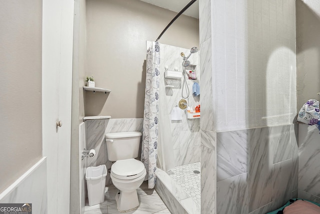5022 Audubon Pl, Norcross, GA 30093 - full bath featuring tile walls, wainscoting, a tile shower, toilet, and marble finish floor