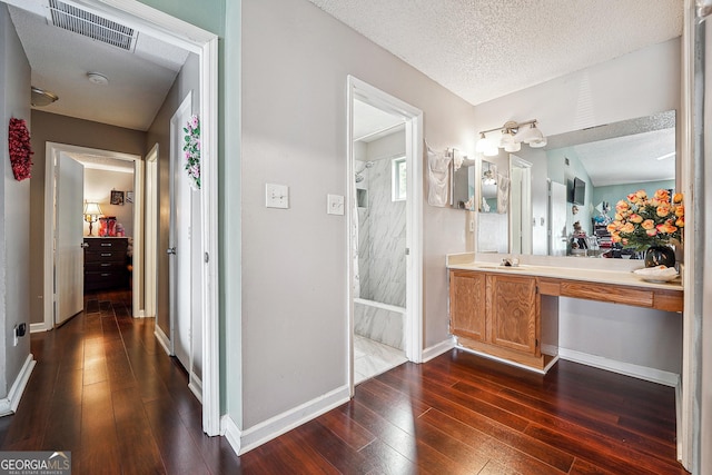 5022 Audubon Pl, Norcross, GA 30093 - full bathroom with a textured ceiling, visible vents, hardwood / wood-style flooring, and vanity