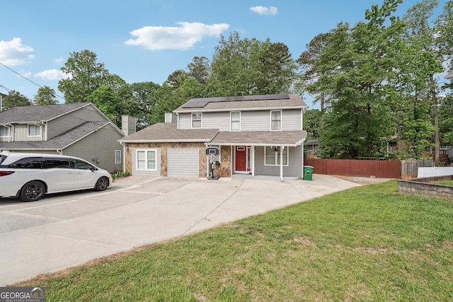 5022 Audubon Pl, Norcross, GA 30093 - traditional home with a porch, roof with shingles, a front yard, fence, and roof mounted solar panels