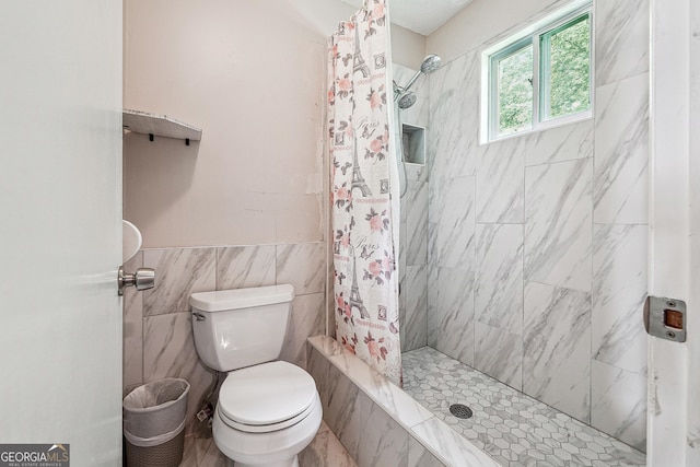 5022 Audubon Pl, Norcross, GA 30093 - full bath with wainscoting, tile walls, a tile shower, and toilet