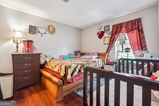 5022 Audubon Pl, Norcross, GA 30093 - bedroom with dark wood-style flooring and visible vents